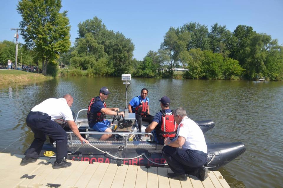 Aurora, IL, firefighters prepare to conduct an exercise on the Fox River in August.