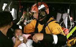 Texas Task Force 1 rescuer Matt Geller, a veteran Dallas firefighter, attends to a woman and her child aboard a helicopter during Hurricane Harvey rescue efforts. Texas Task Force 1 rescuer Matt Geller, a veteran Dallas firefighter, attends to a woman and her child aboard a helicopter during Hurricane Harvey rescue efforts.