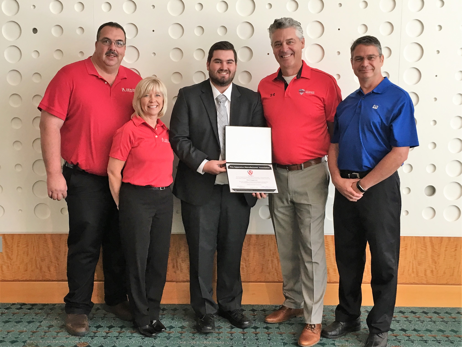 Oklahoma State University student Brett Seggerman (center) received the 2017 Phillip L. Turner Fire Protection Scholarship at Firehouse Expo in Nashville. Seggerman is pictured here with (from left) Akron Brass Senior District Manager Kent Clasen, Akron Brass Director of Marketing Kim Morrow, FAMA Board Vice President Steve Toren and FAMA 2017 Education Committee Chair Lou Milanovich.
