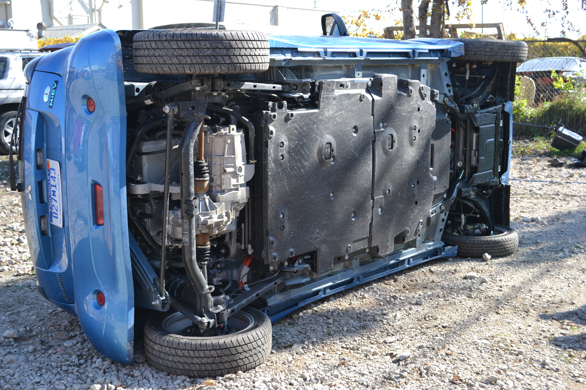 This Mitsubishi i-MiEV was placed driver&rsquo;s side down with the &ldquo;heavy&rdquo; side showing. The large, flat, black area on the undercarriage is the lithium-ion battery that powers this EV. This entire area of the floorpan is off limits for any contact by stabilizing tools, such as struts. Photos by Ron Moore