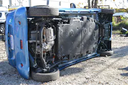 This Mitsubishi i-MiEV was placed driver’s side down with the “heavy” side showing. The large, flat, black area on the undercarriage is the lithium-ion battery that powers this EV. This entire area of the floorpan is off limits for any contact by stabilizing tools, such as struts. Photos by Ron Moore This Mitsubishi i-MiEV was placed driver’s side down with the “heavy” side showing. The large, flat, black area on the undercarriage is the lithium-ion battery that powers this EV. This entire area of the floorpan is off limits for any contact by stabilizing tools, such as struts. Photos by Ron Moore