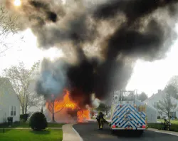 Photo 8: Crews responded to a reported vehicle fire, but it was was in a residential carport with multiple vehicles inside, plus storage. Tactics were changed to structural fire considerations instead of just a vehicle fire. Photo 8: Crews responded to a reported vehicle fire, but it was was in a residential carport with multiple vehicles inside, plus storage. Tactics were changed to structural fire considerations instead of just a vehicle fire.
