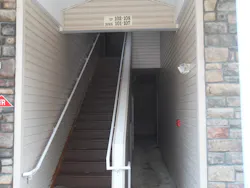 Photo 9: The first-arriving officer should practice 'tactical patience' when determining where to deploy the initial hoseline in multiple dwellings. The location of the address may be obscured by smoke, making deployment more difficult. Photo 9: The first-arriving officer should practice 'tactical patience' when determining where to deploy the initial hoseline in multiple dwellings. The location of the address may be obscured by smoke, making deployment more difficult.