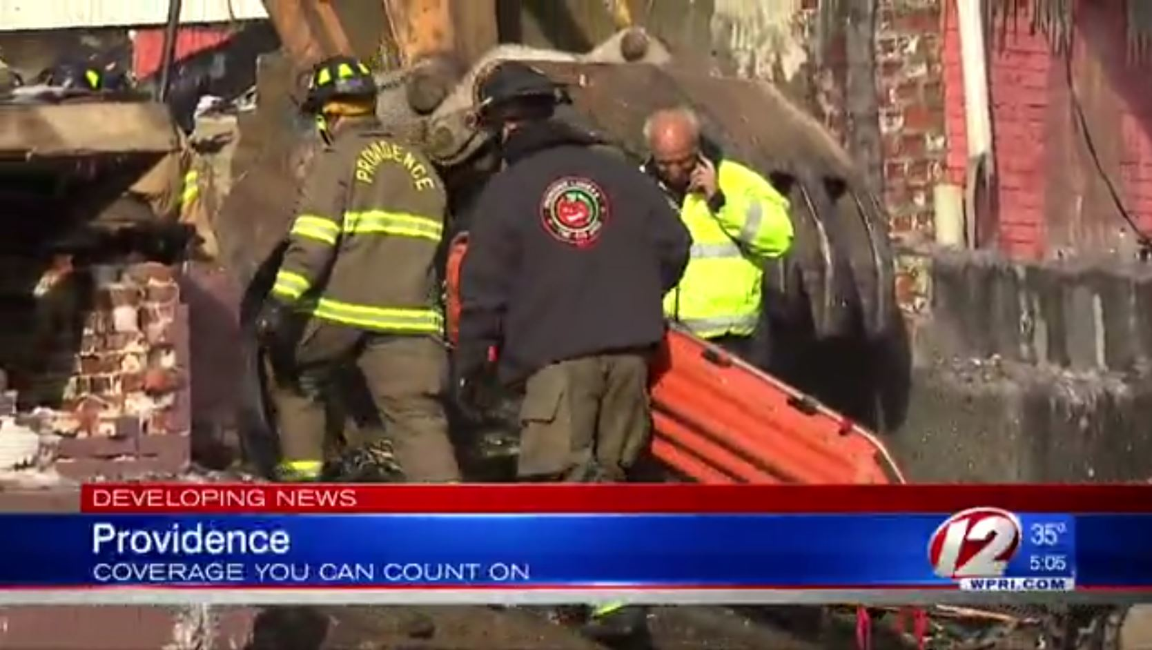 Providence firefighters enter the rubble of a burned down home after a body was discovered on Saturday, Jan. 6, 2018.