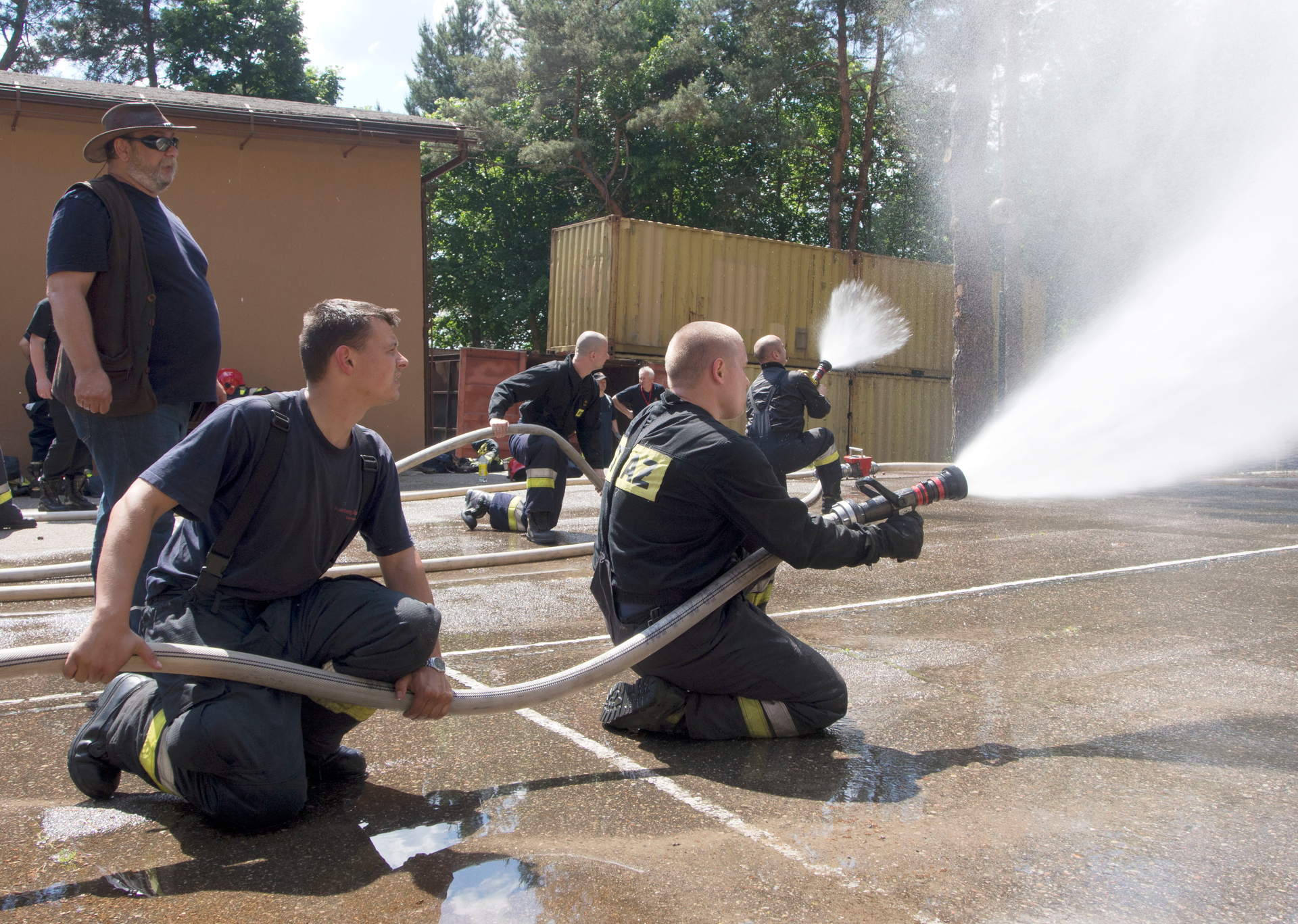 Polish fire instructors 'gas cool' as they advance.