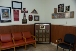 Two walls in the meeting and training room at the West fire station are adorned with memorials. Two walls in the meeting and training room at the West fire station are adorned with memorials.