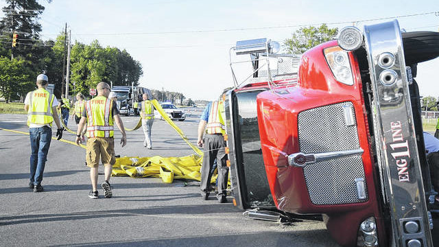 A Laurinburg, NC, apparatus lays on its side after being struck by an SUV while responding to a fire on Thursday, May 3, 2018.