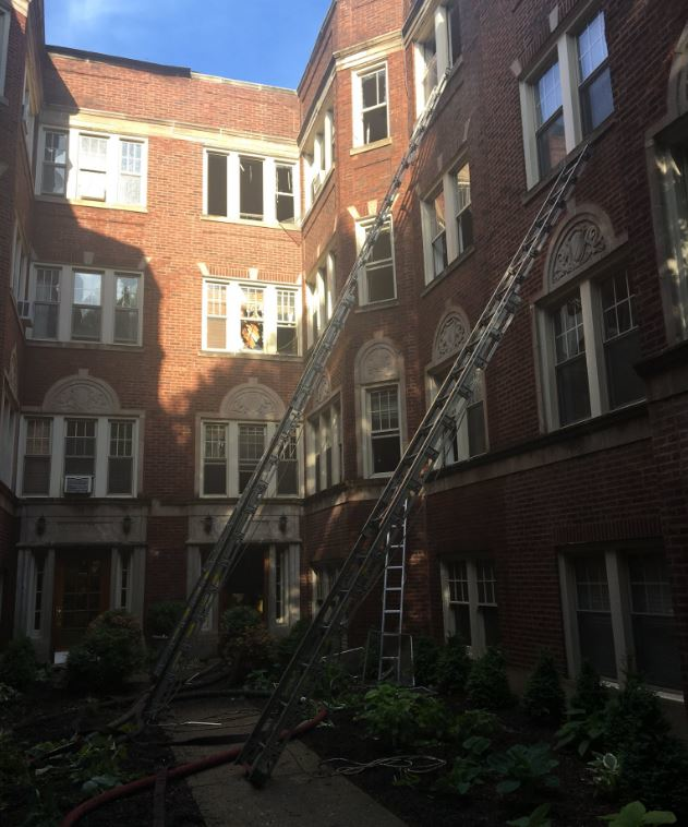 The courtyard of an apartment building in the Rogers Park section of Chicago where two firefighters were injured during a fire on Wednesday, May 23, 2018.