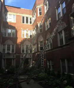 The courtyard of an apartment building in the Rogers Park section of Chicago where two firefighters were injured during a fire on Wednesday, May 23, 2018. The courtyard of an apartment building in the Rogers Park section of Chicago where two firefighters were injured during a fire on Wednesday, May 23, 2018.