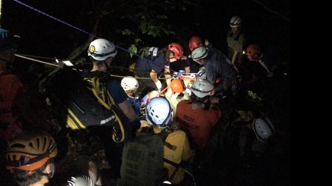 Members of MDI Search & Rescue along with park staff and Bar Harbor, ME, firefighters work to rescue an injured hiker in Acadia National Park on Monday, July 23, 2018.