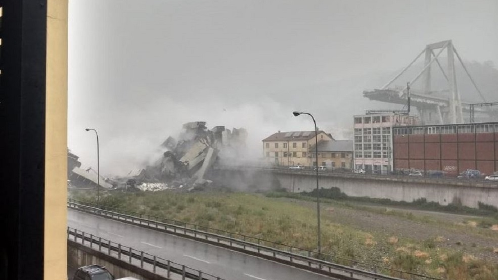 A large section of a motorway bridge lays in ruins after a deadly collapse in Genoa, Italy, on Tuesday, Aug. 14, 2018.