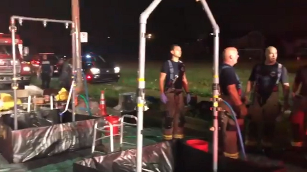 Toledo firefighters on-scene after constructing a decontamination area following a drug bust that led to at least 16 people, including seven police officers, being exposed to a dangerous drug on Tuesday, July 31, 2018.