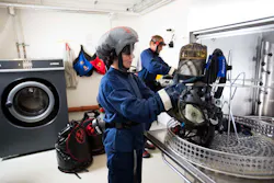 The room used for decontamination of gear should include a ventilation system that generates negative pressure to prevent contaminated air from escaping the room. The room used for decontamination of gear should include a ventilation system that generates negative pressure to prevent contaminated air from escaping the room.