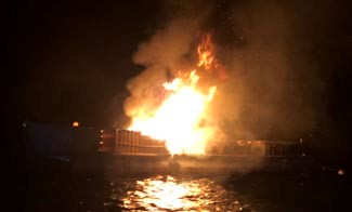 Photo Caption: One of three barges from which fireworks were launched at Lake Tahoe&rsquo;s &ldquo;Lights on the Lake&rdquo; celebration caught fire in the early morning hours of July 5th. The Tahoe Douglas Fire Protection District quickly responded with Marine 24, its new Lake Assault fireboat. The fire, with flames reaching an estimated 30-feet tall, was extinguished in six minutes.