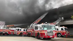 FDNY crews extend ladders along a parking structure at a Brooklyn shopping mall after a disgruntled employee set a fire that consumed dozens of vehicles on Monday, Sept. 17, 2018. FDNY crews extend ladders along a parking structure at a Brooklyn shopping mall after a disgruntled employee set a fire that consumed dozens of vehicles on Monday, Sept. 17, 2018.