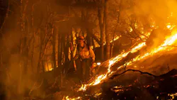 A firefighter monitors a burn operation near the town of Ladoga, CA, on Aug. 7, 2018. A firefighter monitors a burn operation near the town of Ladoga, CA, on Aug. 7, 2018.