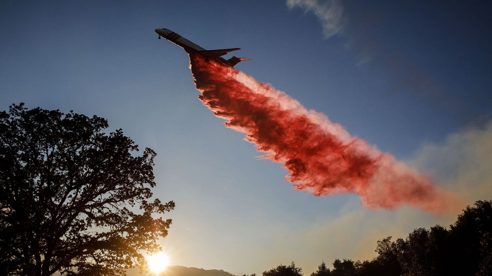 An air tanker drops fire retardant on the River Fire in Lakeport, CA, on Aug. 1, 2018.