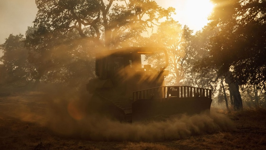 A Cal Fire bulldozer works its way toward the River Fire in Lakeport, CA, on Aug. 1, 2018.
