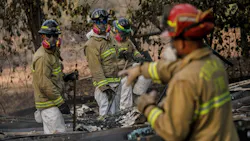 A search and rescue team combs through debris for human remains on Tuesday, Nov. 20, 2018, after the Camp Fire destroyed most of Paradise, CA. A search and rescue team combs through debris for human remains on Tuesday, Nov. 20, 2018, after the Camp Fire destroyed most of Paradise, CA.