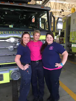 Cathy (center) had many supporters during her cancer journey, including Kyrene Resel (left) and Megan Frye, both volunteer members at the Purcellville Fire Station where Cathy was assigned. Cathy (center) had many supporters during her cancer journey, including Kyrene Resel (left) and Megan Frye, both volunteer members at the Purcellville Fire Station where Cathy was assigned.