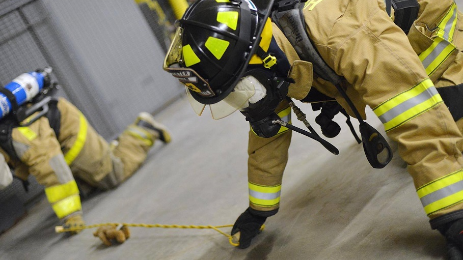 Haddam Volunteer Fire Company firefighters run the 'Jeff's Box' drill, a training exercise that involves working blindfolded with a partner to identify objects in an area.