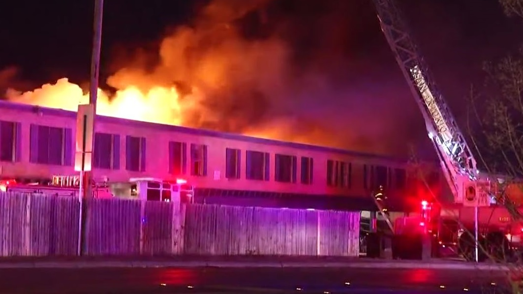 Firefighters rescued two people trapped by smoke and flames on the second floor of a San Antonio apartment complex late Sunday.