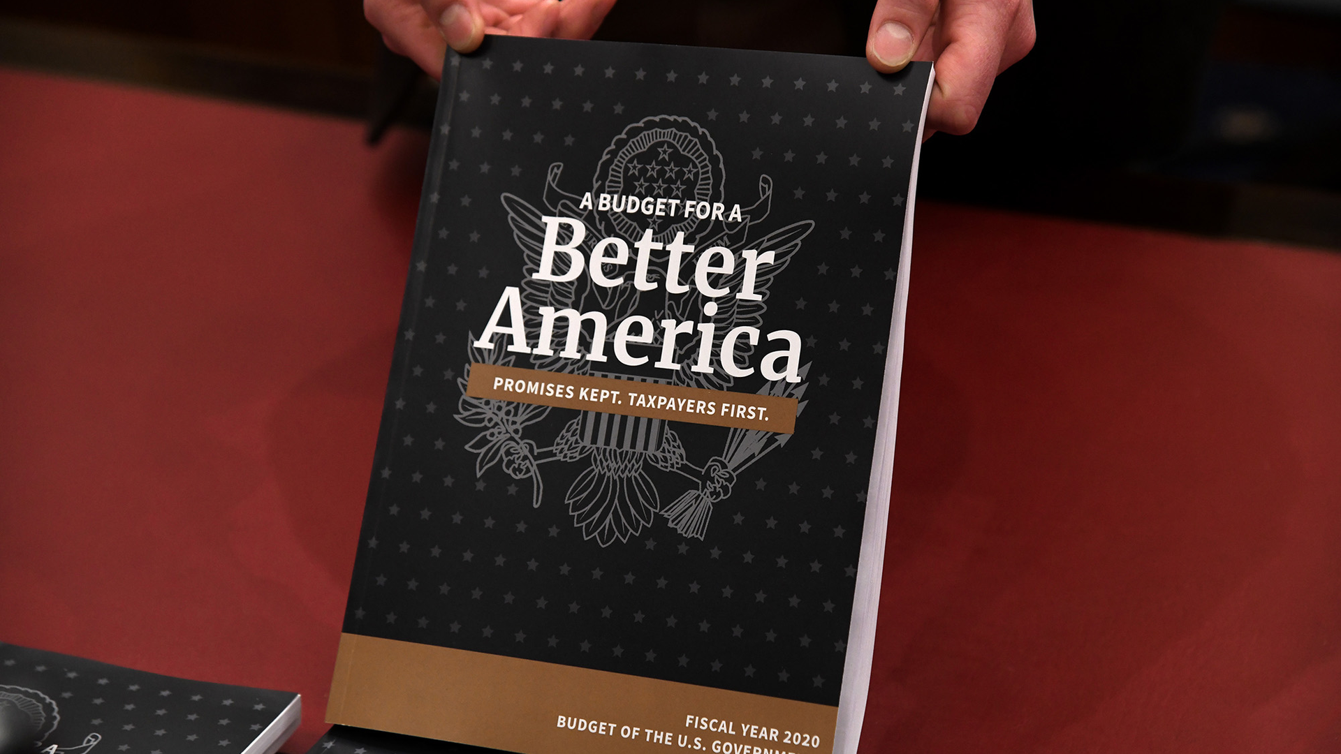 President Donald Trump's budget request for fiscal year 2020 is unpacked by staff in the House Budget Committee hearing room on March 11.