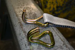 In separate tests, a new twin hook end from a tie-down ratchet strap unit was pulled to failure; bending and failing at 7,380 pounds. This component has a WLL of 2,600 with a 3:1 safety ratio. In separate tests, a new twin hook end from a tie-down ratchet strap unit was pulled to failure; bending and failing at 7,380 pounds. This component has a WLL of 2,600 with a 3:1 safety ratio.