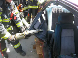 Crews clamp the spreaders on a 45-degree angle to the third door section and bend downward to access the rear seat. Crews clamp the spreaders on a 45-degree angle to the third door section and bend downward to access the rear seat.