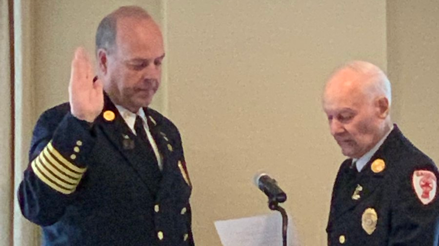 Needham, MA, Fire Chief Dennis Condon (left) is sworn in Tuesday as the new president of the Fire Chiefs Association of Massachusetts.
