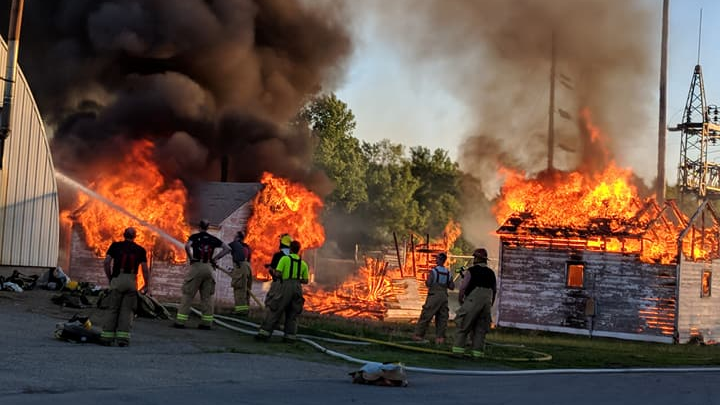 Firefighters from Olivia and Danube volunteer fire departments in rural Minnesota conduct training exercises together in May 2018.