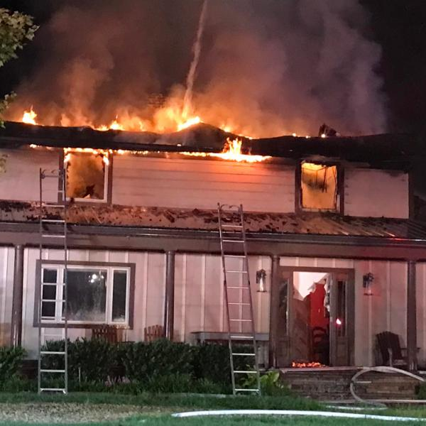 Around 80 firefighters from multiple departments battled the two-alarm house fire Thursday in Lothian, MD.