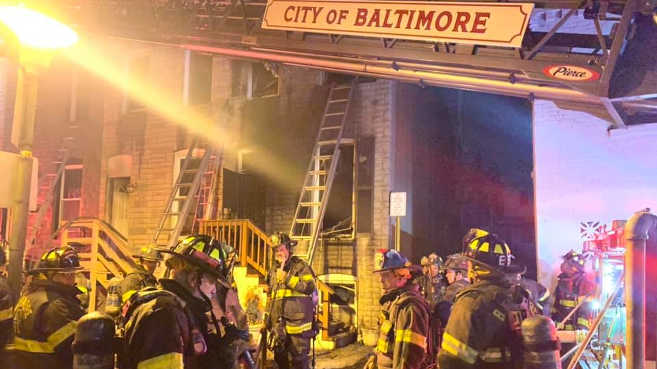 Baltimore City firefighters rescued two residents from a two-alarm fire in East Baltimore's Patterson Park neighborhood late Monday.