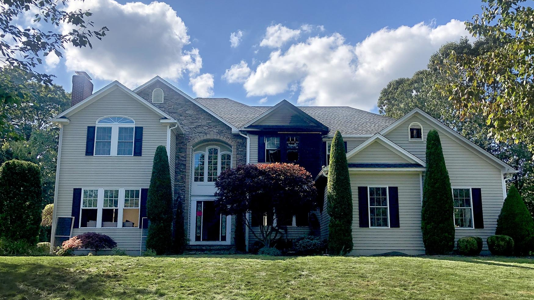 Three firefighters were injured while battling a two-story house fire Tuesday in East Greenwich, RI.