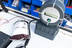 A unit of whole blood and blood warmer. A unit of whole blood and blood warmer.