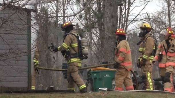 A Normanna Township, MN, volunteer firefighter who was on his way to work rescued two people inside a burning home Tuesday in Rice Lake.
