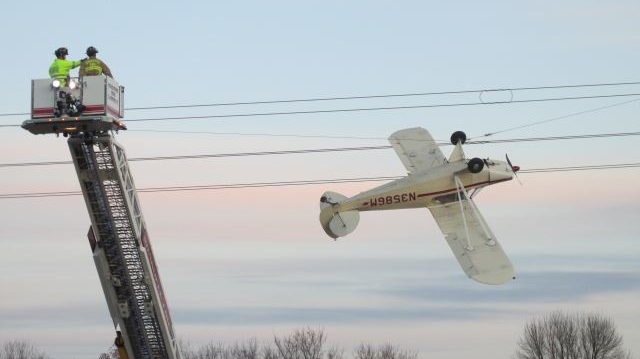 Shakopee, MN, firefighters rescue a pilot whose airplane became entangled in live electrical wires Saturday in Scott County.