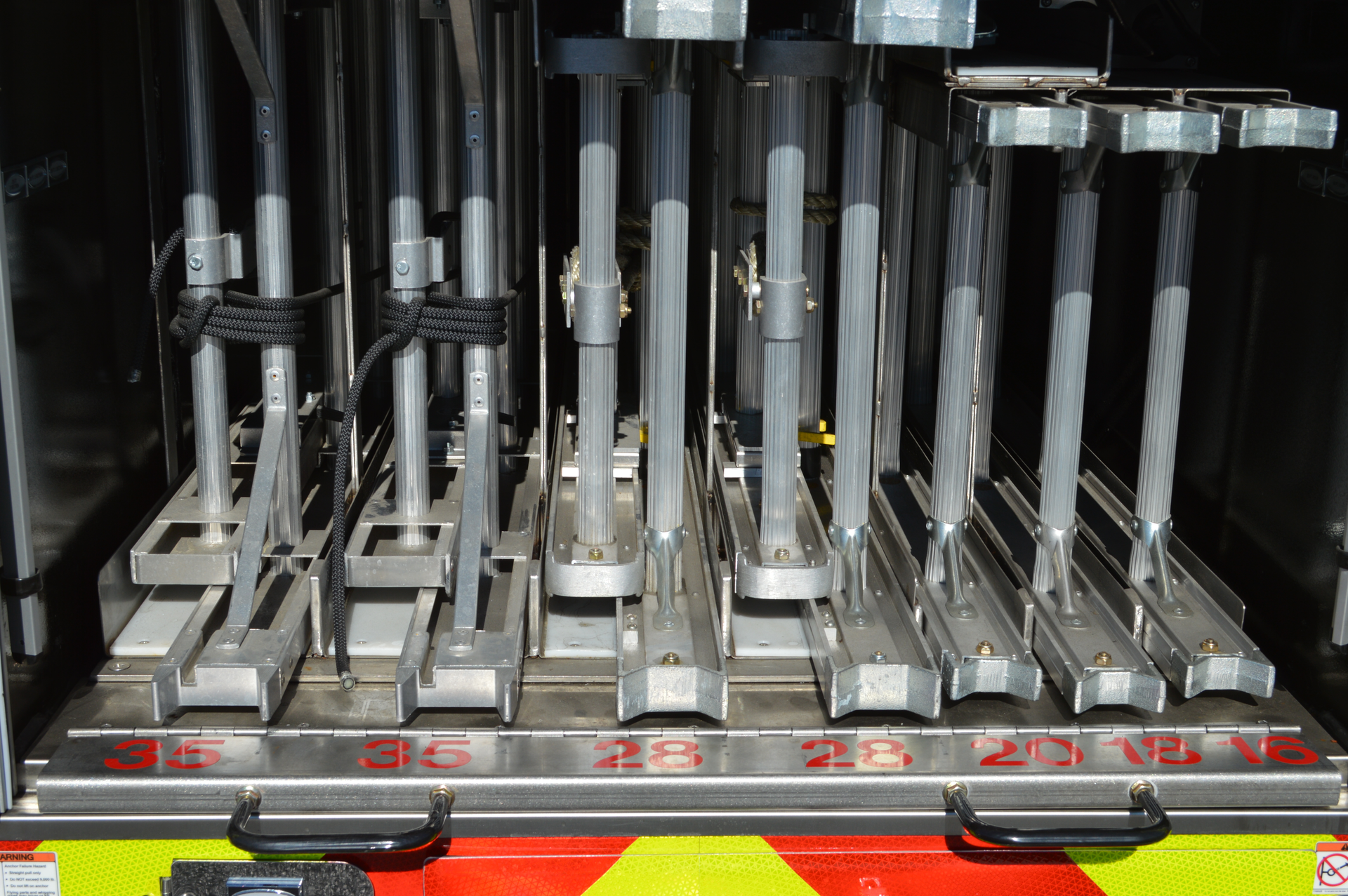 An example of ground ladder banking, where the aerial waterway was run outside of the torque box to accommodate multiple portable ladders.