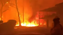 Dramatic video from an Australian firefighter shows flames from a brushfire threatening homes Blackheath valley Saturday. Dramatic video from an Australian firefighter shows flames from a brushfire threatening homes Blackheath valley Saturday.