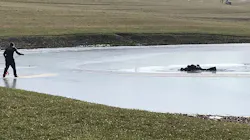 East Wayne, OH, firefighters work to rescue a man and his two grandsons after they fell through ice at a small pond near the village of Dalton on Sunday. East Wayne, OH, firefighters work to rescue a man and his two grandsons after they fell through ice at a small pond near the village of Dalton on Sunday.