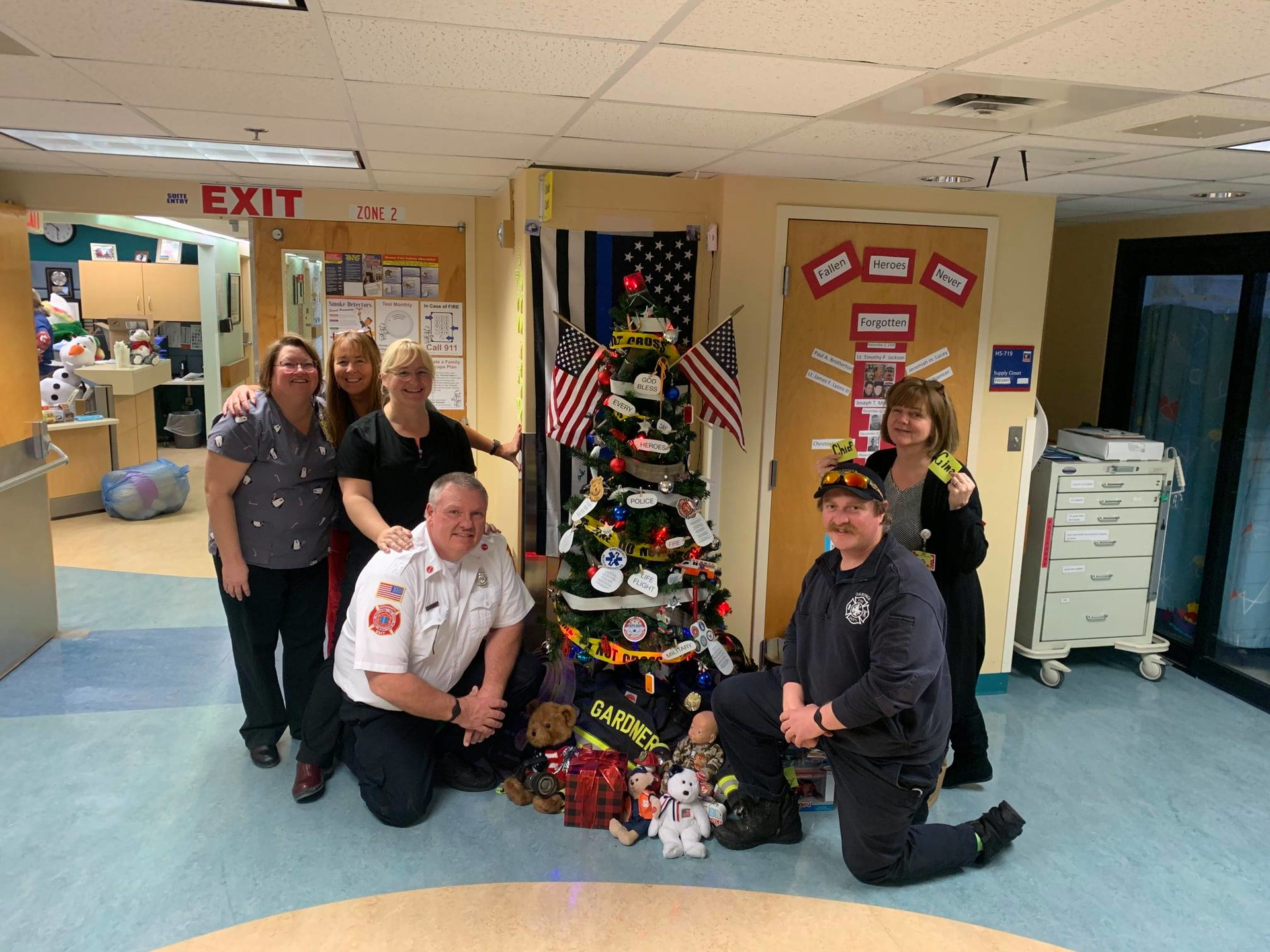 Gardner firefighters with nurses and staff at UMass Worcester after delivering over 400 teddy bears.