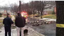 Officials gather at the scene after a plane crashed into a New Carrollton home Sunday. Officials gather at the scene after a plane crashed into a New Carrollton home Sunday.