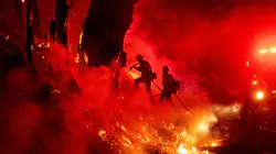 Firefighters work to control flames from a backfire during the Maria fire Nov. 1 in Santa Paula, CA. Firefighters work to control flames from a backfire during the Maria fire Nov. 1 in Santa Paula, CA.