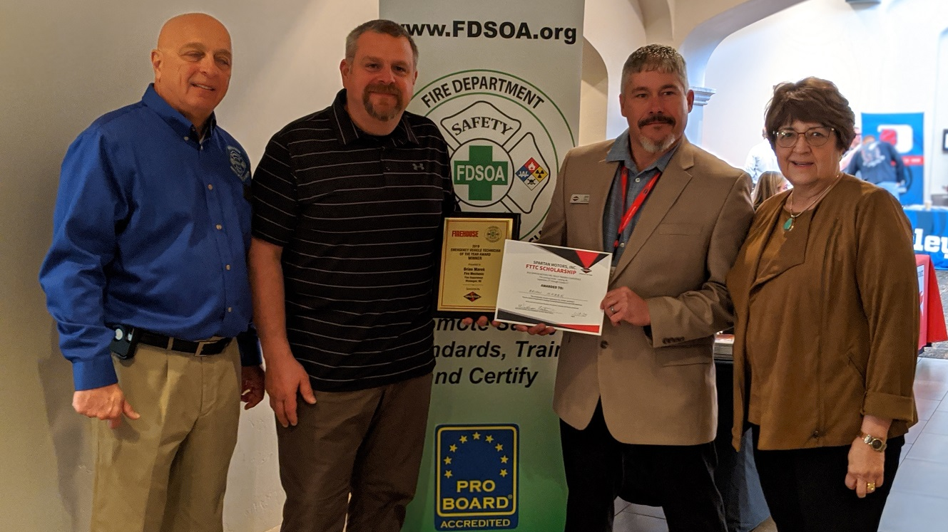 EVT of the Year Award winner Brian Marek, second from left, poses with, from left, FDSOA Executive Director Rich Marinucci, OEM Accounts Manager for Spartan Motors Jeff Seal, and Janet Wilmoth, Special Projects Director for Firehouse, at the FDSOA conference in Scottsdale, AZ.