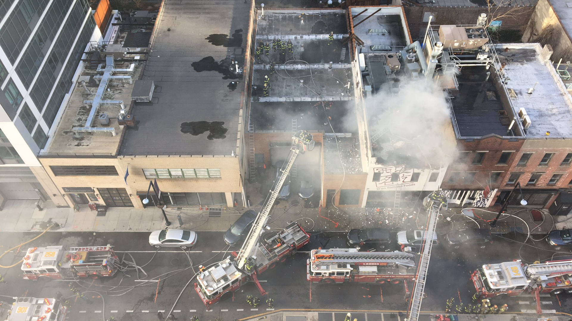 FDNY firefighters responded to a three-alarm blaze at the Xi'an Famous Foods location in the Long Island City area of Queens on Thursday.