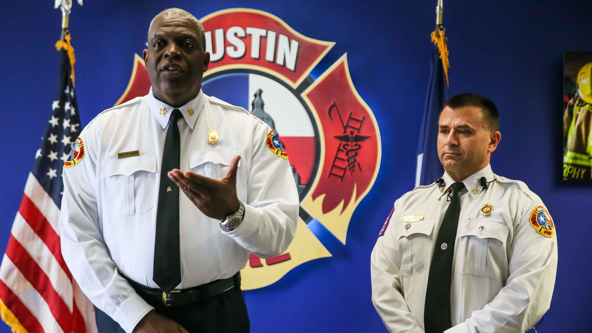 Austin, TX, Fire Chief Joel Baker (left) and Assistant Fire Chief Aaron Woolverton, who oversees emergency operations, respond to complaints of foamy, chemical-smelling tap water in the Tanglewood Forest neighborhood in South Austin after firefighters put out a nearby church fire.