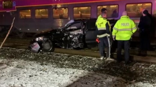 Two Ashland, MA, firefighters pulled several men out of the way of an oncoming train after their car became stuck Thursday night.