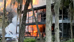 Firefighters from multiple departments kept at a safe distance as ammunition went off while they doused a burning house with water Sunday. Firefighters from multiple departments kept at a safe distance as ammunition went off while they doused a burning house with water Sunday.