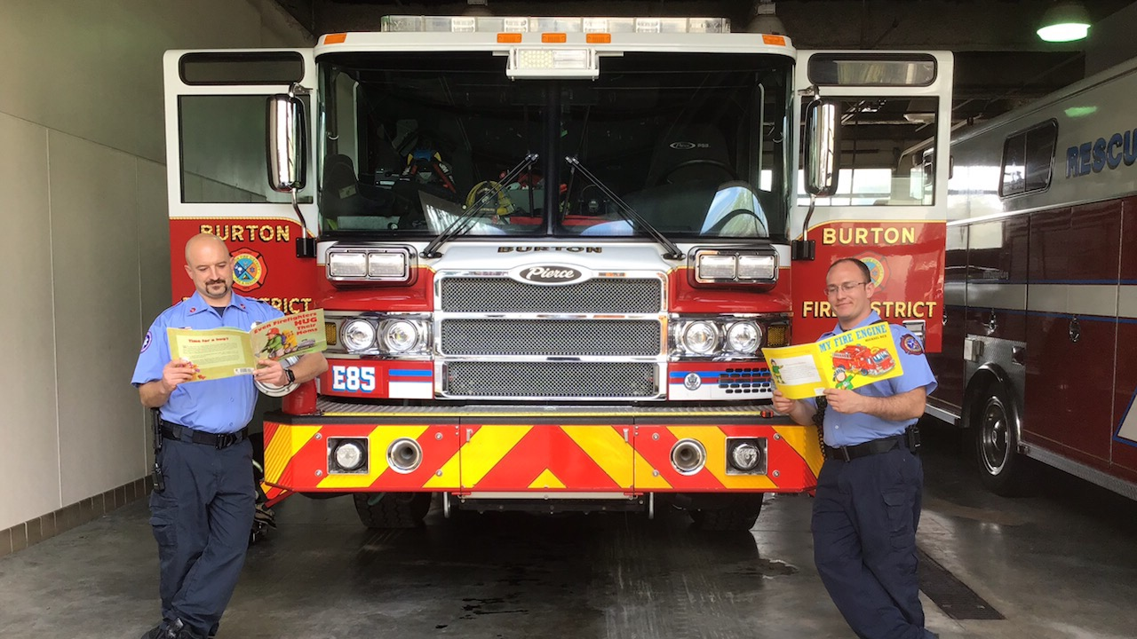 Burton Fire District firefighters participate in a local school&rsquo;s Virtual Spirit Week &ldquo;What are you reading today?&rdquo; while also illustrating proper social distancing.