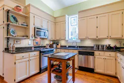 The modern kitchen is located in space that was used as a horse stable in the 1800s. The modern kitchen is located in space that was used as a horse stable in the 1800s.